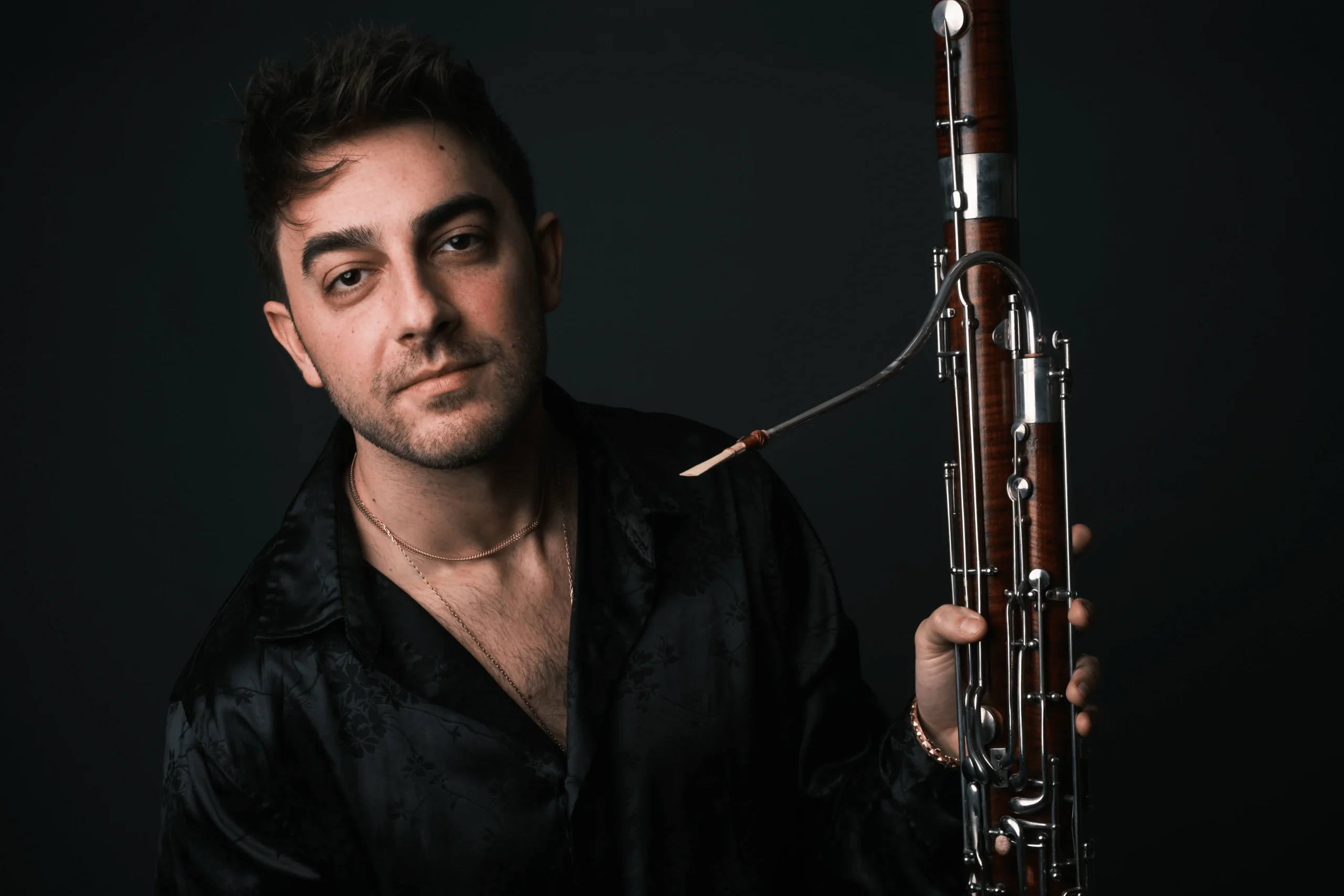 Portrait photo of Mavroudes Troullos holding a bassoon