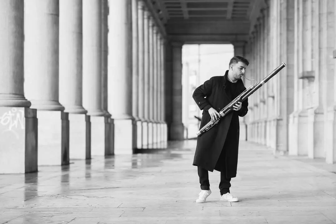 Action photo of Mavroudes Troullos playing a bassoon